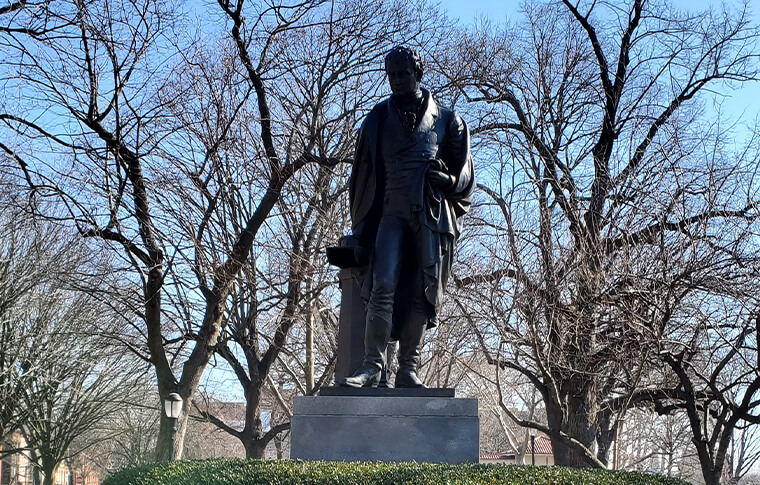 black stone statues of Robert Fulton in Fulton Park