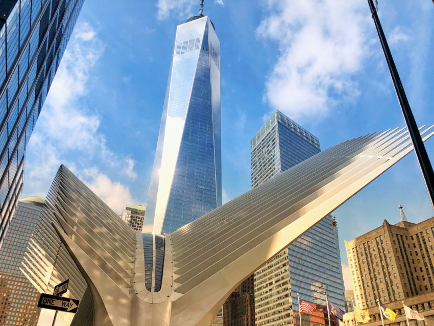World Trade Center tower and the Oculus in front sun reflecting